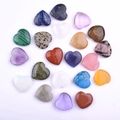 Mix of 21 heart-shaped natural gemstones including rose quartz and amethyst on white surface - All Materials Mixed Colors