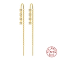 Dettaglio di orecchini pendenti in argento S925 dorato con stelle di cristallo - Oro - Stella a quattro punte Zircone bianco