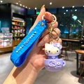 Cute Sanrio Hello Kitty keychain featuring purple teacup design and embossed blue strap - Purple Cup Hello Kitty (B474-3) / Single Piece