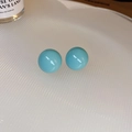 Detailed macro view of bright blue spherical stud earrings on a textured white tray - 19# Silver Earring Post-Regular-ai-Bright Blue (Bright Blue Round Studs)