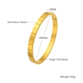Detail view of 6mm wide gold stainless steel bracelet with mirror polished finish - Gold