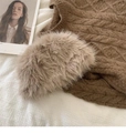 Detailed view of the thick faux fur collar and cable knit texture on a brown winter vest - Khaki