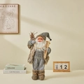 Babbo Natale nordico in maglia grigia con stivali di pelliccia e bastoncini da sci - 45cm