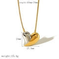 Macro shot of two-tone heart necklace pendant with gold and silver finish on snake chain - Gold Silver Two-Tone Heart Necklace Style (TN3349-M)