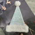 Detailed view of white Christmas hat featuring iridescent sequins and soft plush trim - 31*47cm / Pearl White