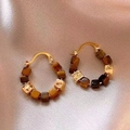 Detailed shot of gold hoop earrings with tiger eye stone beads on soft pink silk fabric - 8# Ear Buckle - Gold - Brown (Real Gold Plated)