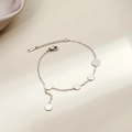 Macro shot of silver geometric heart charm bracelet with lobster clasp and extension chain - Silver Tassel Round Disc(S222)