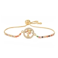 Adjustable gold tree of life bracelet with colorful stones and evil eye charms on white background - Tree of Life Multi-color Stone Chain Style / Gold Colorful Zircon Chain