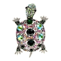 Macro detail of a silver turtle brooch with colorful rhinestones and blue gemstones - Turtle Shape / Dark Green
