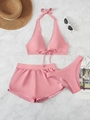 Close-up of pink three-piece swimsuit with halter top and sports shorts on marble background - S / Pink