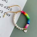 Detail of rainbow clay beads and freshwater pearls bracelet with gold heart charm - White Heart Pendant/Multicolor