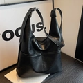 Matte black leather bucket bag with wide shoulder strap and hobo design for women - Black