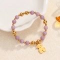 Elastic beaded bracelet with purple natural stones, gold beads and a bear charm - Purple Beads-Gold Solid Bear Charm
