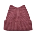 Macro detail of the wine red ribbed knit texture and cute cat ear design on the winter hat - Burgundy
