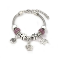 Detail of silver snake chain bracelet with purple charms featuring tree of life and butterfly - Light Purple (A1-006)