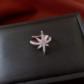 Close-up of a silver zircon star ear cuff with tassel details on a black jewelry box - Silver-Star (Single)