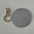 Grey round faux leather keychain with gold ring and detailed stitching on textured surface - Unassembled (DIY Set) / Light Gray