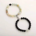 Detail of magnetic stone bracelets for couples showing blue and matte black round beads - Amazonite & Frosted Black With Round Magnet