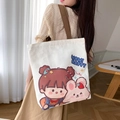 White canvas tote bag with cartoon girl print and brown straps worn by a model - Girl and Rabbit