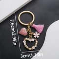 Detailed view of butterfly rose keychain showing 7.6cm x 3cm size with pink heart pendant - Pink Tassel Hollow Heart Style (ER728)