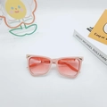 Pink cat-eye sunglasses with orange gradient lenses and golden triangular accents - Pink