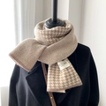 Detail of brown and beige knitted scarf showing houndstooth texture and Nice To Meet label - Houndstooth Coffee