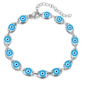 Detailed view of silver evil eye bracelet with blue marquise charms and lobster clasp - Silver Base Light Blue