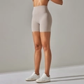 High-waisted beige yoga biker shorts with seamless slimming fit for fitness activities - Sandstone