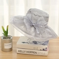 Elegant silver grey organza sun hat with oversized mesh bow detail on a display stand - One Size / Gray