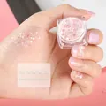 Mermaid Iridescent White fish scale sequins in a jar shown on skin for makeup - Single Jar / Mermaid Iridescent White