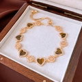 Detail of 18K gold-plated adjustable bracelet with heart tiger eye stone and star charms - 18K Gold Plated Tiger's Eye Heart Bracelet / Gold