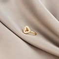 Detail of a gold heart-shaped non-pierced nose clip with micro-inset zircons on silk - Heart (E5689-12)