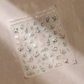 Stickers ongles 3D TL-186 avec lys blancs, nœuds verts et accents de perles - Style Fleur Blanche Noeud Vert Note de Musique (TL-186)