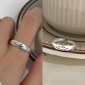 Minimalist silver open ring with smiley face design shown on hand and tray - Simple Smiley Pattern Open Ring (J3370)