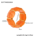 Detail showing orange marble resin blocks and gold stainless steel bars on elastic bracelet - 60mm / Orange (E677)
