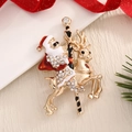 Christmas brooch featuring Santa on reindeer with gold plating and white crystals - BR0053-Santa Riding Deer