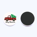 Close-up of glass Christmas magnets showing red truck tree design and magnetic back - Plaid Truck