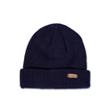 Detailed close-up of navy knit beanie featuring a brown leather deer head patch label - 51-53cm / Navy Blue