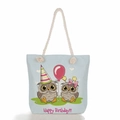 Detail of light blue canvas tote bag with cartoon owls and beige rope handles - Blue Happy Birthday Owl Celebration