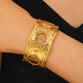 Wide gold hammer-textured open cuff bracelet featuring three large circular cutouts - Hollow Round Window Wide Style (9448)