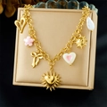Collana in acciaio inossidabile placcato oro con ciondoli sole cuore fiocco e perla - Stile Multi-Pendenti Dorato (N3724)