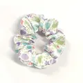 Detail of silk-like satin scrunchie with Easter bunny patterns and floral prints - White Rabbit Egg