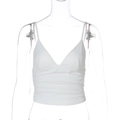 Detailopname van de verticale ribgebreide textuur van deze witte crop top met V-hals - S / Wit