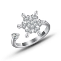 Detail of a rotating silver snowflake ring with sparkling zircon and adjustable band - Baguette Snowflake Spinner