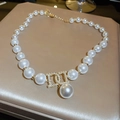 Close-up of gold plated flower necklace with white pearls and luxury crystal pendant - Pearl Letter Pendant Style (22#)