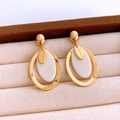 Detail of vintage gold round earrings with white inlay and Hand Made charm on velvet - Gold-White