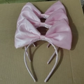 Three pink satin bow headbands for girls displayed on a textured background - Satin Bow / Pink