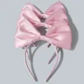 Three pink satin bow headbands for girls displayed on a textured background - Satin Bow / Pink