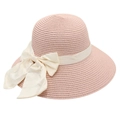 Close-up of the fine straw weave and cream ribbon bow on this pink sun hat for women - Pink