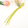 Detail of yellow and black woven phone lanyard flat-laid on a white background - Yellow